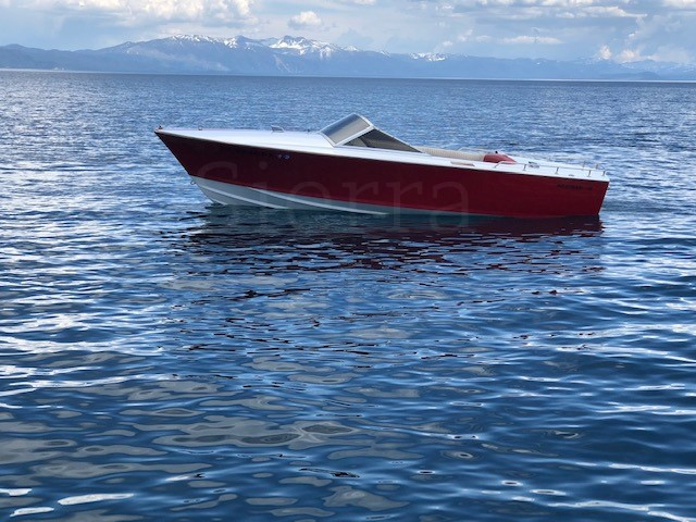 A small boat in a large body of water
