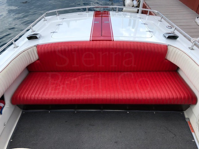 A red and white boat sitting on top of a table