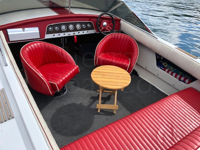 A boat sitting on top of a red chair